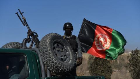 Afghan security personnel outside of hotel