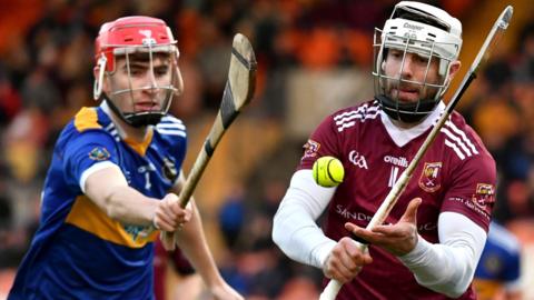 Portaferry's Ronan Smyth attempts to get in a challenge on Cushendall's man of the match Neil McManus in Armagh