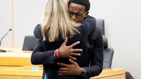 Botham Jean's younger brother Brandt Jean hugs former Dallas police officer Amber Guyger