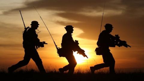 Silhouettes of British soldiers