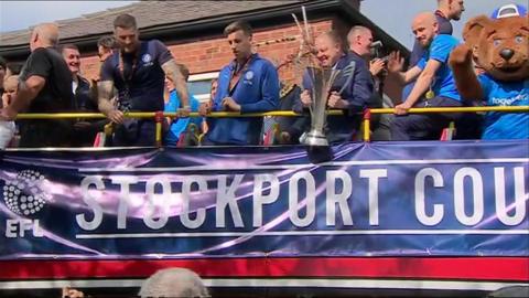 Open top bus parade of trophy
