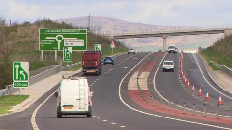 Cars driving along the newly opened A6 road