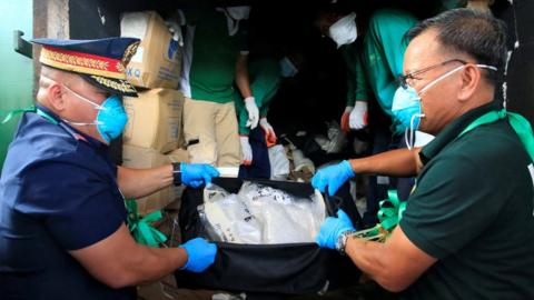 Philippine National Police (PNP) Chief Director General Ronald Dela Rosa (L) and Philippine Drug Enforcement Agency (PDEA) Director General Isidro Lapena, display a bag full of methamphetamine hydrochloride