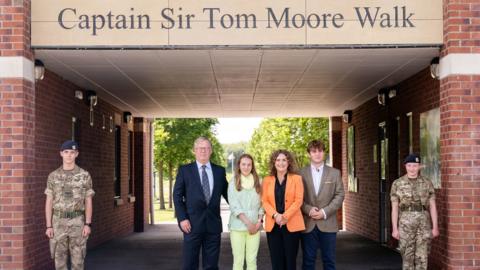 The family of Captain Sir Tom Moore left to right Colin Ingram-Moore (son in law), Georgia Ingram-Moore (granddaughter), Hannah Ingram-Moore (daughter) and Benjie Ingram-Moore (grandson), during the grand opening of a walkway dedicated to Captain Tom at the Army Foundation College