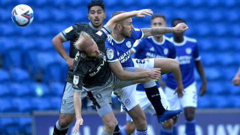 Players challenge for aerial ball