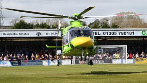 Air ambulance lands on pitch