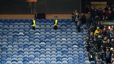 Empty seats after Burnley fans evacuated over metal hanging from the roof