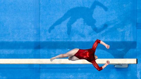 A gymnast on the beam