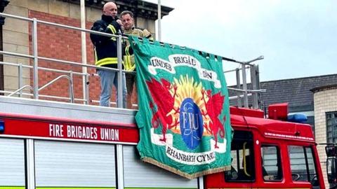 Firefighters on a fire tender