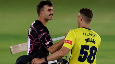 Somerset's Ben Green and Brad Wheal of Hampshire