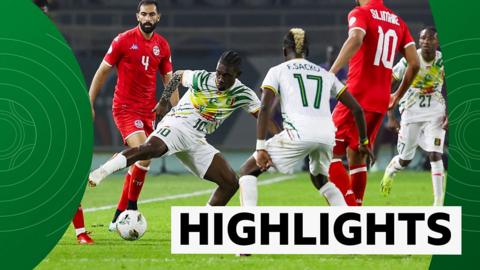 Players compete for the ball as Tunisia take on Mali in Afcon 2023