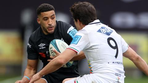 Keelan Giles of Ospreys is tackled by Nicholas Casilio of Zebre