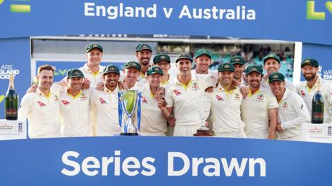 Australia with the Ashes urn after the series was drawn 2-2