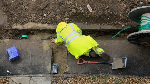 Engineer laying internet cable