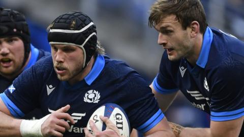Jonny Gray carries against France with brother Richie in support