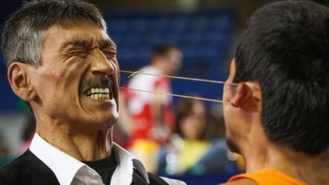 Competitors in the earpull at the World Eskimo-Indian Olympics: