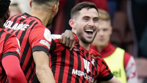 Lewis Cook celebrates scoring his goal