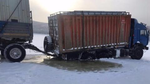 Truck on frozen river in Siberia