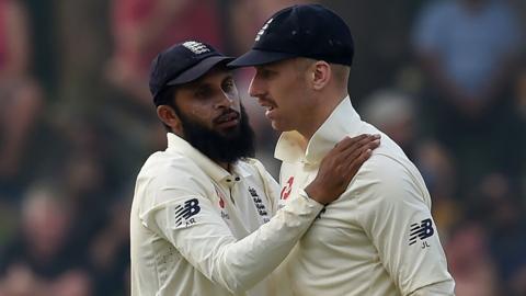 England spinners Adil Rashid (left) and Jack Leach (right) talk during the second Test against Sri Lanka