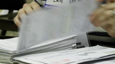 Workers begin a statewide presidential election recount Thursday, 1 December 2016, in Milwaukee.