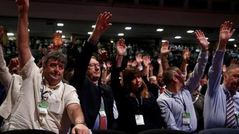 Len McCluskey and other Labour delegates voting on the Brexit motions