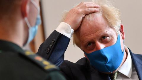Boris Johnson wearing a mask