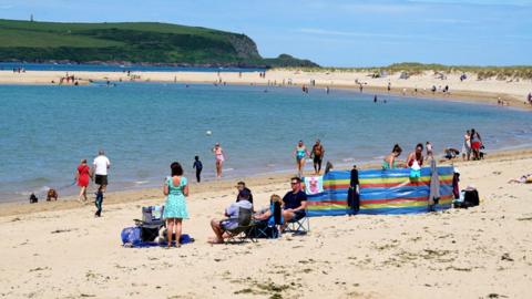 Holiday-makers on the beach on July 12, 2020 in Rock, United Kingdom