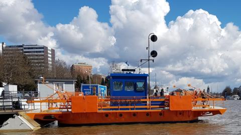 The Fori, docked on one side of the Aura River