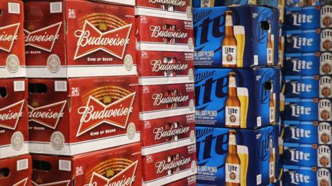 Cases of Budweiser and Miller Lite on display in a Chicago store