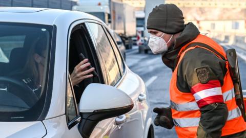 A driver is checked on February 12, 2021 at the Austrian-German border in Kufstein in Austria's Tyrol