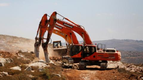 Diggers break ground for the new Jewish settlement of Amichai in the occupied West Bank (20 June 2017)