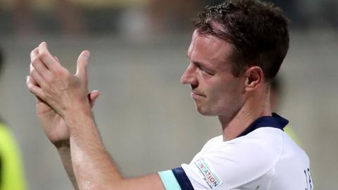 A deflated Jonny Evans acknowledges the Northern Ireland fans after the draw with Cyprus