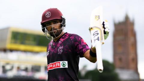 Babar Azam lifts his bat to the crowd after scoring 95 for Somerset in the 2019 T20 Blast