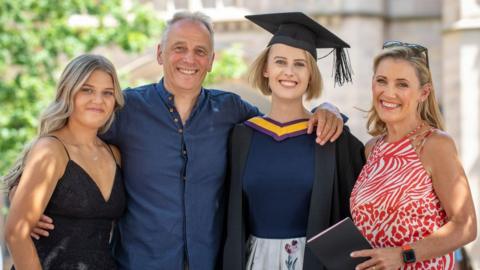 Laura Nuttall with her mum Nicola, dad Mark and sister Grace