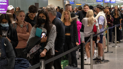 People queue at Heathrow airport