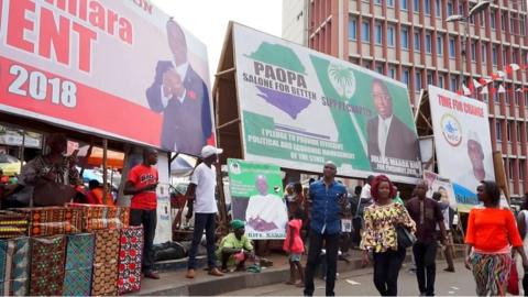 Billboards showing Sierra Leone presidential candidates