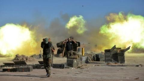 Shia Popular Mobilization Forces (PMF) fire against Islamic State militants on the outskirts of Tal Afar, Iraq, 20 August 2017.