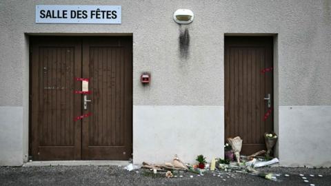 Flowers outside the dance hall where a 16 year-old was murdered on 19 November