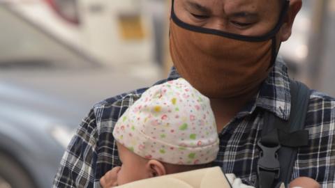 Man and baby in Delhi