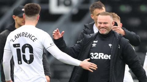 Wayne Rooney celebrates with his players