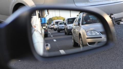 car wing mirror in traffic