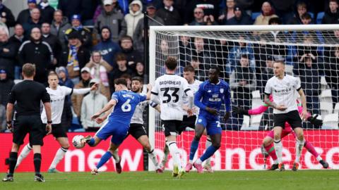 Cardiff player Ryan Wintle scores a goal