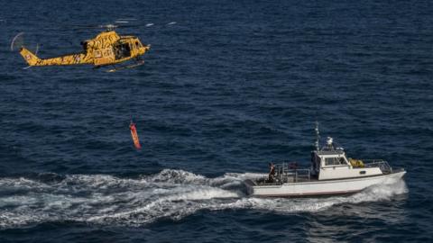 A CH-146 Griffon helicopter takes part in a simulated rescue exercise off the coast of Miami