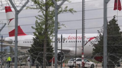 Albanian police handout shows Austrian Airlines plane on runway at Tirana airport