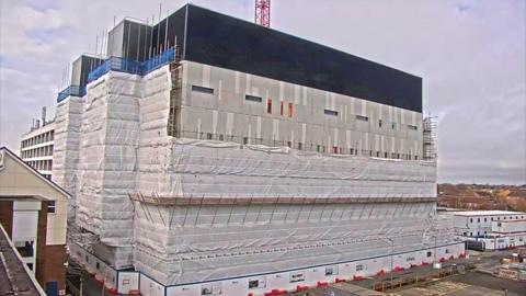 The new building at Luton and Dunstable Hospital, covered in cladding and plastic sheeting
