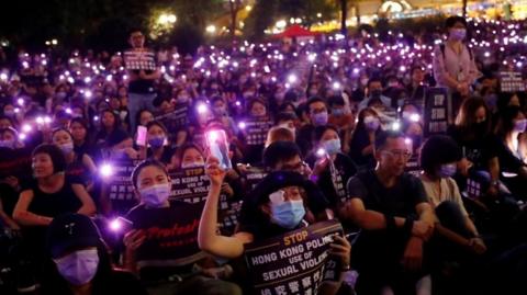 Protesters carry placards in Hong Kong
