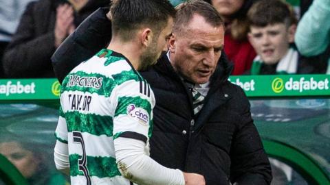 Celtic's Greg Taylor and Brendan Rodgers