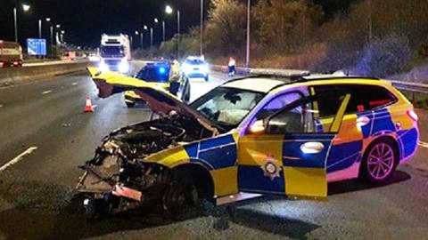 The police car which was rammed into a barrier on the M1