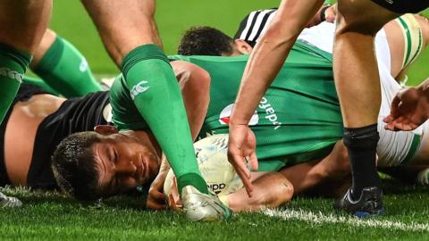 Nick Timoney stretches to score Ireland's second try in Wellington