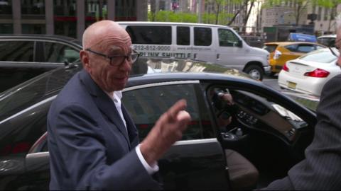 Rupert Murdoch answers questions outside his New York offices